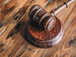 Wooden judge's gavel on the table as a trial concept photo