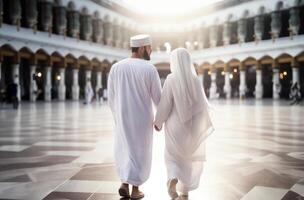 Portrait of a Muslim couple in white Ihram garments at a sacred site, reflecting their devotion and unity during pilgrimage.Generated image photo