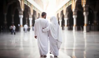Portrait of a Muslim couple in white Ihram garments at a sacred site, reflecting their devotion and unity during pilgrimage.Generated image photo