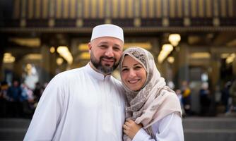 Portrait of a Muslim couple in white Ihram garments at a sacred site, reflecting their devotion and unity during pilgrimage.Generated image photo