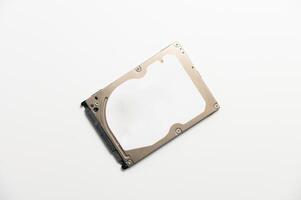 White background on which lies a sleek hard drive, combining modernity and simplicity in a technologically minimalist aesthetic. photo