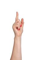 Female hand pointing, index finger extended and varnished in red, signaling direction. Right hand photo
