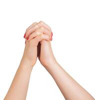Intertwined hands with fingers clasped, symbolizing unity and support. Gesture of approval and photo