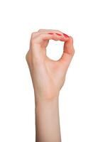 Hand showing the sign for zero, with thumb and forefinger forming an O. Isolated on white background photo