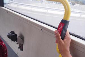 Closeup of Bus bell switch for stop inside the public bus photo