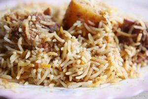 mutton biryani meal in a plate on table. photo