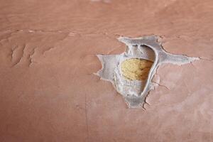 damage Leather with a cracked texture on a sofa . photo