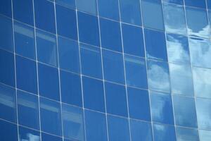 This is an abstract reflection created on a blue tiled surface that brings serenity and elegance photo