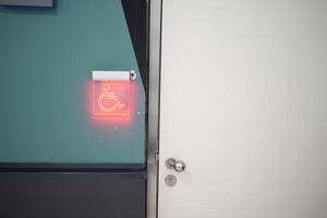 Modern and Accessible Restroom Signage featuring an Illuminating Red Indicator Light photo
