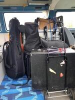 The instruments in the cases are loaded into the van. photo
