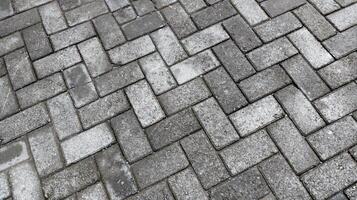 Outdoor gray paving blocks stone texture photo
