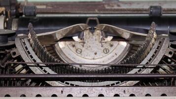 Closeup shot of types and mechanism of retro typewriter photo