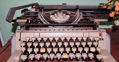 Closeup shot of types and mechanism of retro typewriter photo