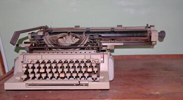 Closeup shot of types and mechanism of retro typewriter photo