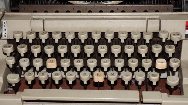 Closeup shot of types and mechanism of retro typewriter photo