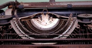 Closeup shot of types and mechanism of retro typewriter photo