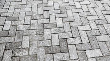 Outdoor gray paving blocks stone texture photo