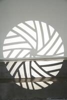 The ledge of the step with a shadow from the light pattern. The silhouette of the gobo mask on the wall surface with space to copy. photo