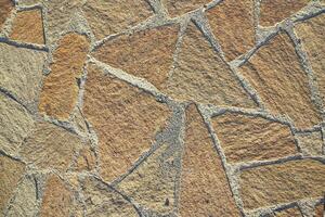 Rock masonry, seamless textured surface. Road material or floor material with space to copy photo