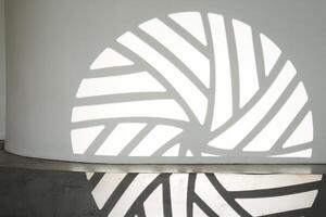 The silhouette of the gobo mask on the wall surface with space to copy. A step ledge with a shadow from a light stroke photo