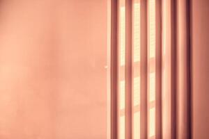 Abstract peach fuzz background with geometric vertical slats, backdrop with copy space, light and shadow pattern. Stylish template, mock up for your design, art, poster, presentation photo