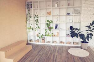 Room with podium, cells, shelves placing goods, products, art objects, pictures for advertising. Mock up, template for presentation, show product. Background with copy space, white, peach fuzz color photo