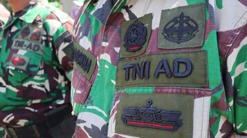 The Indonesian Army or TNI AD are conducting a parade of troops photo