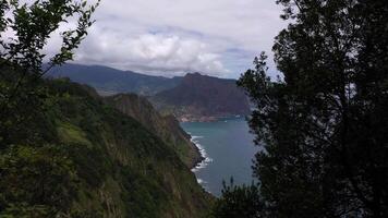 Penha d'Aguia Mountain on Cloudy Day and Ocean. Vereda do Larano. Madeira, Portugal. Aerial View. Moving Forward video