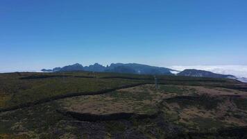 Wind Turbines on Mountain Plateau in Madeira on Sunny Day. Cloud Inversion. Portugal. Aerial Drone Shot. Moving Forward and Upwards video