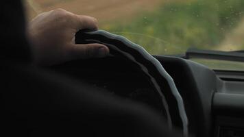 man hands on the steering wheel of an suv video