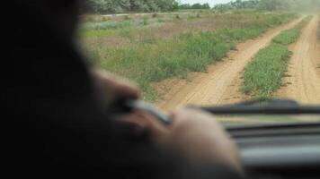 man hands on the steering wheel of an suv video
