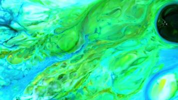 Abstract background with psychedelic painting in colorful vivid colors. Organic effect with fluid painting moving and sliding slowly. Swirls and spreading. video