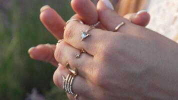 Closeup of Hands with Gold Rings and White Polish video
