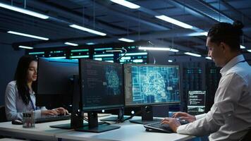 Computer scientist using AI tech on PC to do checkup in server room. IT staff member in data center using artificial intelligence technology to process datasets for training, camera B video
