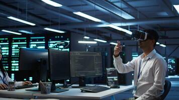 Engineer wearing VR headset in data center installing software on computer, troubleshooting issues. IT expert in server hub using virtual reality tech, establishing performance benchmarks, camera B video