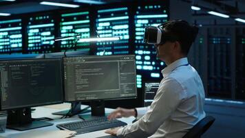 Data center admin responsible for installation of networking systems wearing high tech VR headset. IT worker doing maintenance on server farm gear using virtual reality technology, camera A video