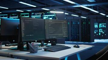 Computers in data center used for managing infrastructure rigs energy consumption. PC screens in high tech workplace used for automation and monitoring processes in server farm video