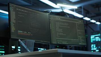 Computers in data center facility used for managing hardware mainframe energy consumption. Close up on PC displays in high tech establishment used for automation and monitoring processes in server hub video