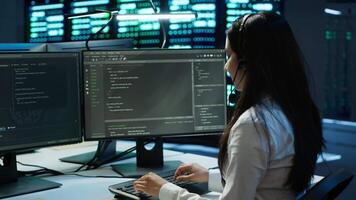 Data center call center agent responsible for providing logistics support to businesses. Worker in server farm establishment oversees infrastructure systems and communicates with engineers, camera A video