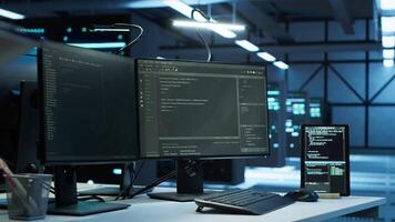 Programmer in data center arriving in office, being tasked with ensuring system can handle networking tasks. IT specialist in server farm starting job shift, tracking network traffic with PC, camera A video