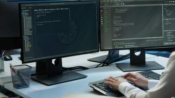 Programmer in data center typing on computer keyboard, ensuring system can handle networking tasks. IT specialist in server farm tracking network traffic with PC, camera A video