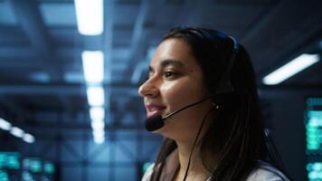 IT expert in data center provides technical support to customers, troubleshooting issues, close up. Server room employee carrying out operational technical interventions requested by clients, camera B video