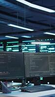 Vertical Server rows and computer used to ensure optimal performance and reliability, managing gear. High tech data center facility used for overseeing network connections, panning shot video