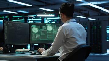 Computer scientists in server room protect hardware from hacker attack stealing sensitive information. Data center cybersecurity division teamworking colleagues fighting security breach, camera A video