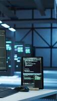 Vertical Programmer in data center arriving in office, being tasked with ensuring system can handle networking tasks. IT specialist in server farm starting job shift, tracking network traffic with PC, camera A video