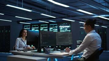 Data center agent providing logistics support to businesses and overseeing infrastructure. Server farm worker oversees hardware rackmounts and communicates with technicians, camera B video