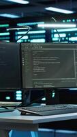 Vertical Data center network engineer designing, implementing and managing infrastructure to ensure optimal performance and reliability. IT expert in server room coding on computer, camera A video