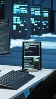 Vertical Engineer in data center sitting down at desk, installing software on computer, troubleshooting issues. Woman arriving at work in server hub, establishing performance benchmarks, camera A video