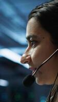 Vertical IT expert in data center provides technical support to customers, troubleshooting issues, close up. Server room employee carrying out operational technical interventions requested by clients, camera A video