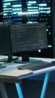 Vertical Person with disability in inclusive high tech server room facility ensuring data remains shielded from threats. Wheelchair user protecting data center hardware equipment, camera A video